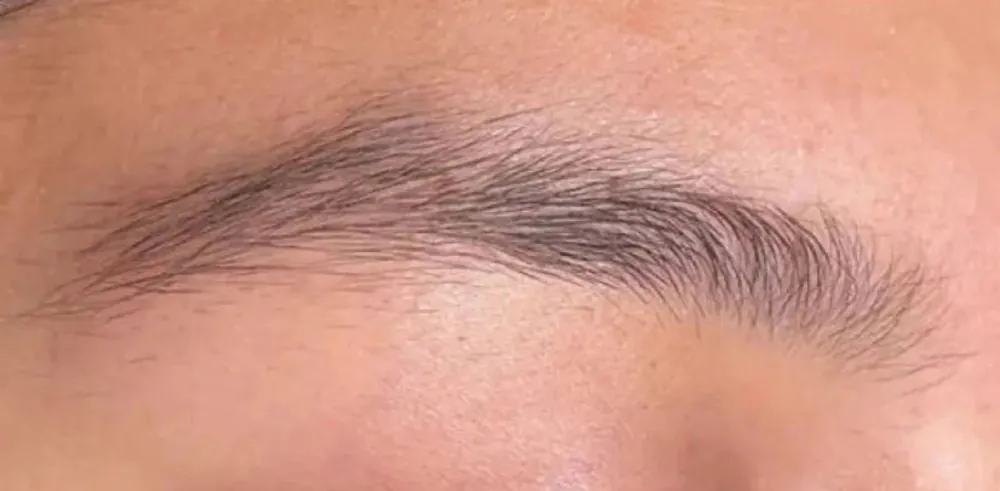Brows before: sparse and uneven